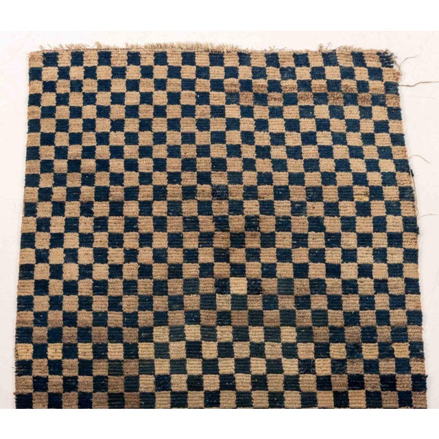 Tibetan Blue and White Checkered Khaden Wool Rug. 4' 8" L x 2' 5" W. Provenance: From the Estate of Joseph Lawrence Gardella.