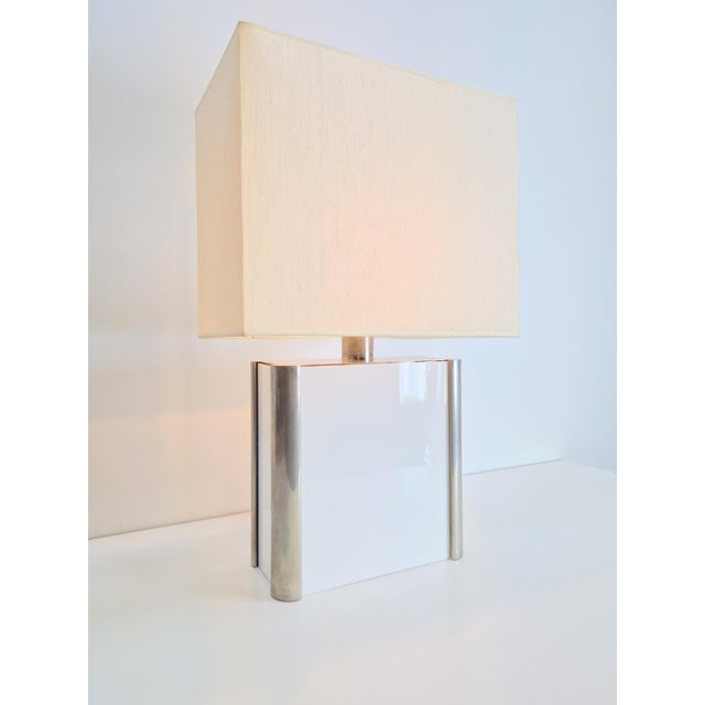 A very aesthetically pleasing table lamp designed in the style of Milo Baughman from the 1960s. Comes with free hood...