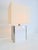 A very aesthetically pleasing table lamp designed in the style of Milo Baughman from the 1960s. Comes with free hood...