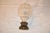 Circa 1900 English Edwardian period cut crystal newel post finial supported on a hand-cast bronze base. This newel post...