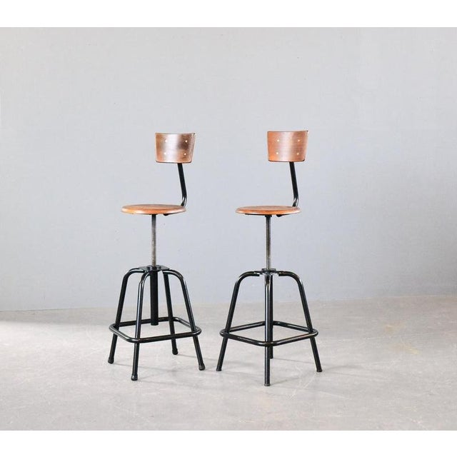 Height Adjustable Industrial Bar Stools By L Sautereau Circa 1950s Tubular steel frames with black paint - Elm/ply seats...