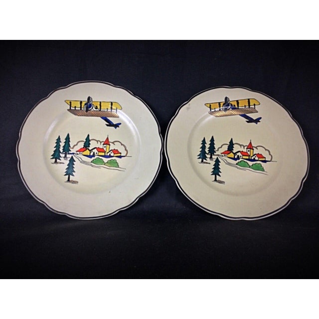 Enhance your collection with this charming pair of antique Longwy plates, each featuring the delightful "Vacance" motif....