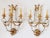 Stunning large pair of Regency Style silver and gold gilt wall sconces with laurel leaf swag and rosettes motifs. It...