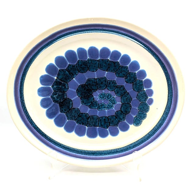 Offered is an oval-shaped stoneware serving platter of the "Moondance" pattern crafted by Franciscan in the United States...