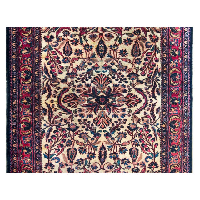 A beautiful early 20th century Persian Lilihan rug with the most wonderful mirrored floral pattern with a central...