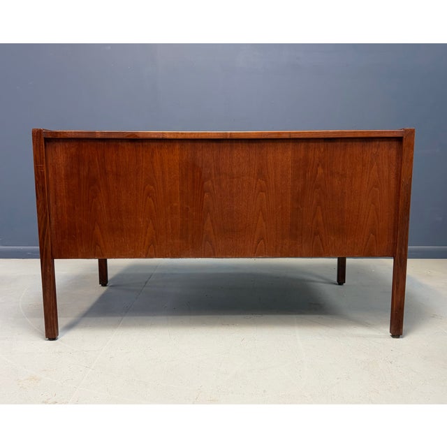 Elevate your workspace with this 1960s Mid-Century Modern walnut writing desk by Jens Risom. This desk showcases rich...