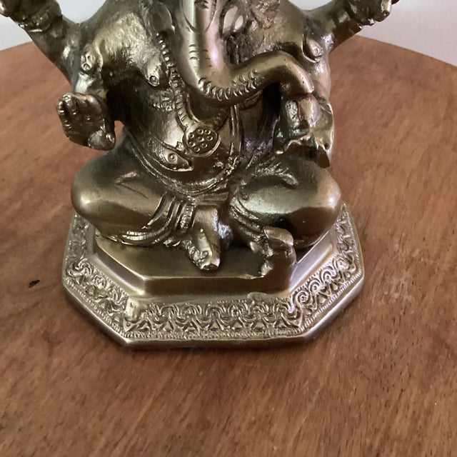 This Vintage Handcrafted Solid Brass Ganesha Idol Statue is a beautifully crafted piece that showcases the intricate...