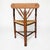 Early 20th century Dutch corner chair with triangular rush seat, turned legs, and spindle back support. The compact form...