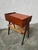 : Teak bedside table with one drawer and a wicker shelf, designed by Søren Rasmussen in the 1960s. The teak wood gives it...