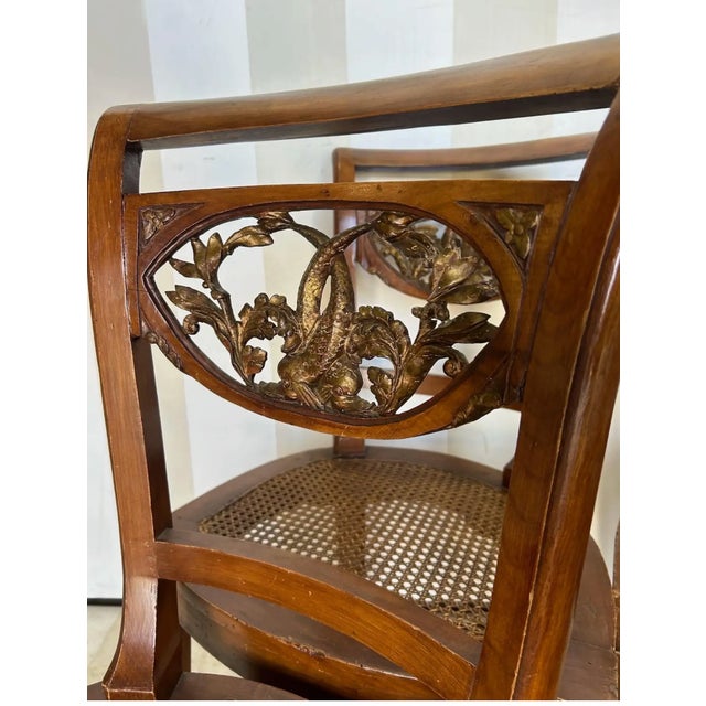 Set of 5 Italian Neoclassical Dining Room Chairs with Giltwood Carved Dolphin backs. Four side chairs and one Arm chair....