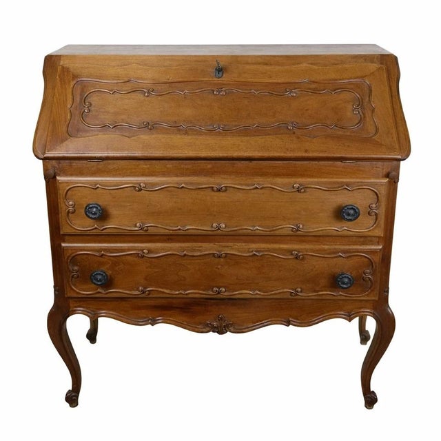 Louis xv style writing desk – 20th century an elegant louis xv style writing desk, crafted from solid wood with a warm,...