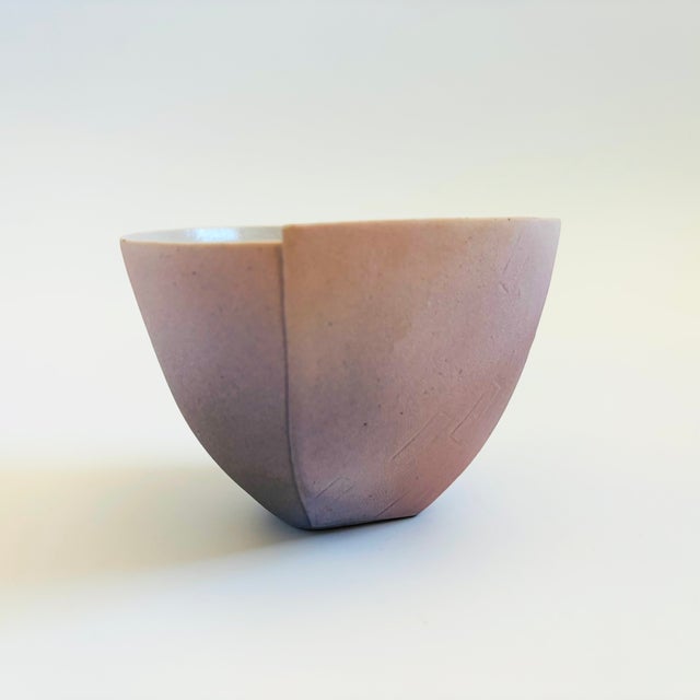 A vintage hand made pottery tea bowl by Japanese ceramicist, Kazuo Takiguchi (born 1953). Delicately formed from a single...