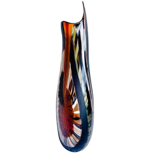 An extraordinary statement piece of Italian glassmaking, this monumental hand-blown Murano glass vase features a...