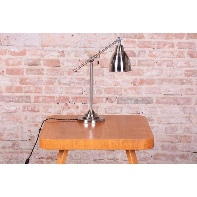 Socket: E27 This industrially styled and purposeful table lamp dates from the 1930s in Czechoslovakia, reflecting...