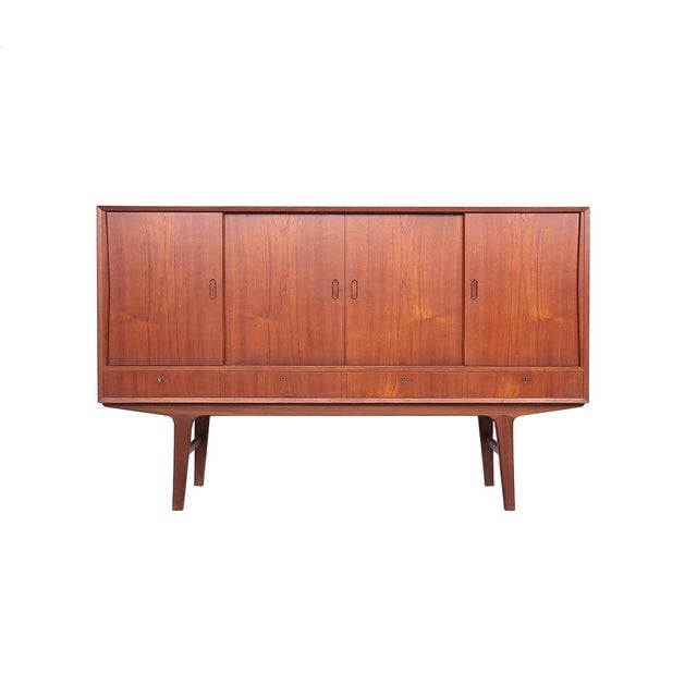 Danish design highboard from the 1960s The sideboard is veneered in warm teak. Beautiful, sleek design with typical Danish...