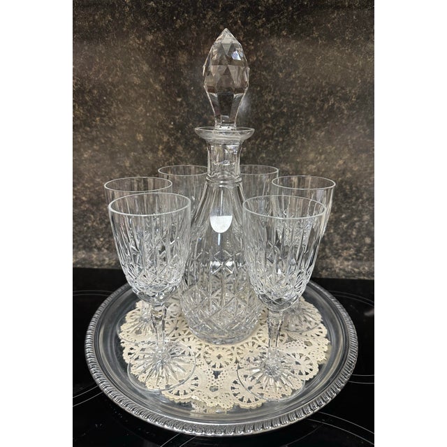 This is a beautiful and elegant set of Edinburgh crystal - a ships decanter, 6 glasses and a silver tray. We bought this...