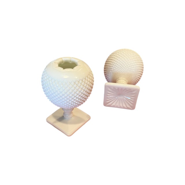 A stunning pair of Westmoreland milk glass diamond hobnail pedestal vases, balancing a classic silhouette with a clean,...