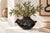 A sculptural bird-form vessel in deep, glossy black, signed on the base Rito Talavera Quezada of Mata Ortiz, Chihuahua,...