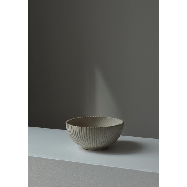 Fluted stoneware bowl with beautiful matte beige glazing made by Danish artist Arne Bang at his own studio in Copenhagen...