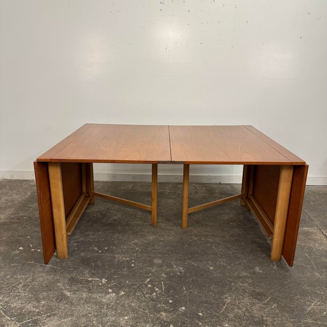 Mid Century Modern Bruno Mathsson Gateleg dining Table "Maria Flap.” This unique dining table is made of teak and has a...