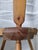A beautifully shaped, three-legged stool made of pine wood in good used condition. There is a crack in the seat. The stool...