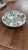 Brighten your decor or dining collection with this striking hand-painted Turkish ceramic shallow bowl. Rendered in...