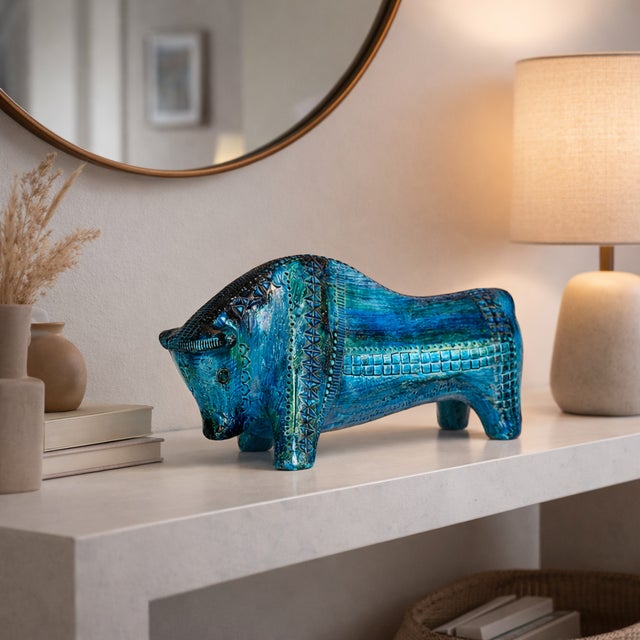 Sculptural ceramic bull from the renowned Rimini Blu collection, designed by **Aldo Londi** for **Bitossi Ceramiche**,...