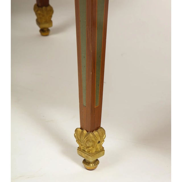 An exceptional pair of Louis XVI style french ormolu-mounted parquetry and marquetry side tables, 20th century, in the...