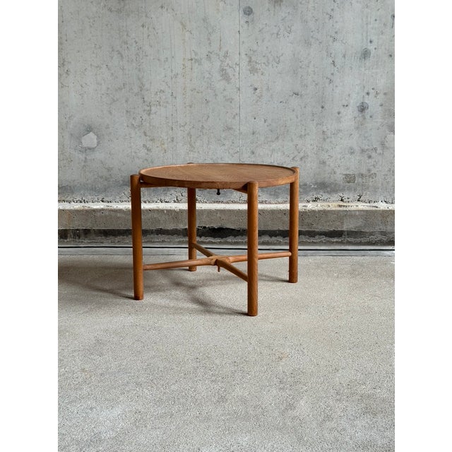 An early edition AT35 folding tray coffee table designed by Hans J Wegner for Andreas Tuck, Denmark 60's. The table is...
