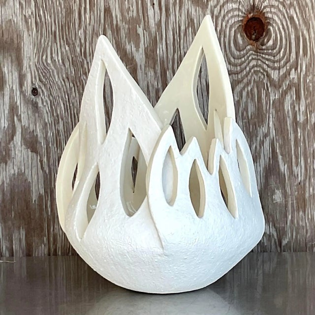 This late 20th-century vintage studio pottery cache pot boasts a dramatic flame-shaped design, making it a striking...