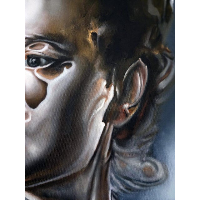 This striking artwork portrays a surreal figure set against a softly blurred background, emphasizing the subject's...