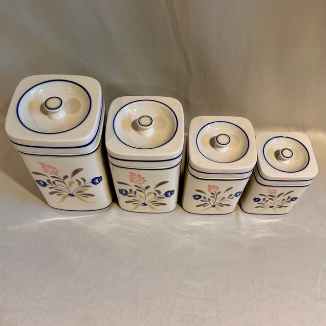 A lovely Portuguese white kitchen canister seat with handpainted pink and blue floral motif in a thick and extremely heavy...