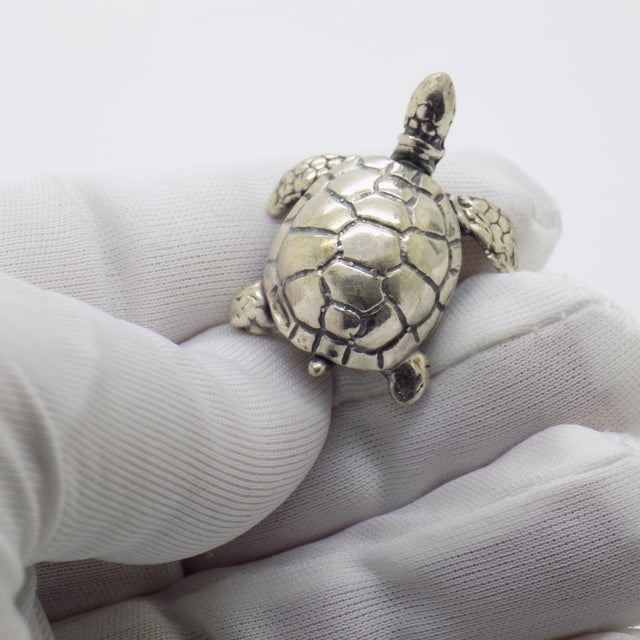 This vintage silver figurine depicts a sea turtle created as a dollhouse miniature. Handcrafted in Arezzo, Tuscany during...