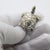 This vintage silver figurine depicts a sea turtle created as a dollhouse miniature. Handcrafted in Arezzo, Tuscany during...