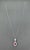 A stunning platinum pendant necklace showcasing modern elegance. This exquisite piece features a 1.97-carat natural pear-...