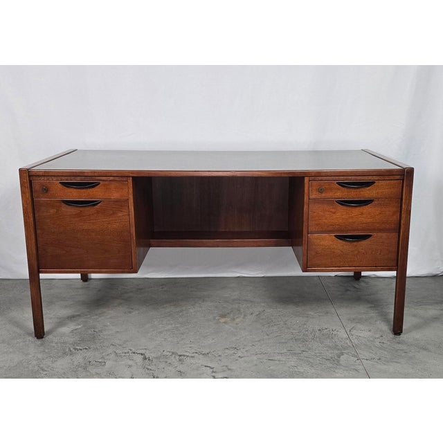 An authentic, museum-caliber mid-century modern double-pedestal executive desk designed by master Danish-American...