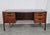 An authentic, museum-caliber mid-century modern double-pedestal executive desk designed by master Danish-American...