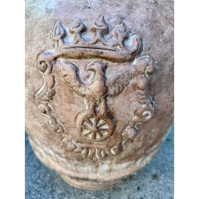 A striking large-scale vintage terracotta garden urn in the Italian Renaissance Revival tradition, featuring elaborate...