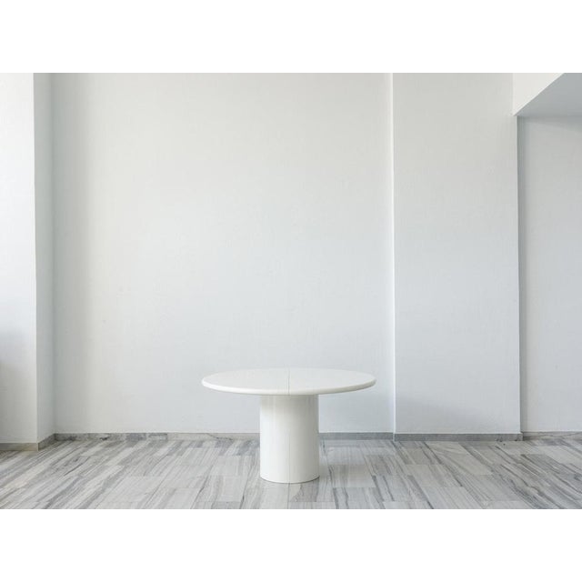 Stunning super long extendable dining table in white lacquer. The min. dimensions are 100 cm diameter as a round table and...