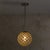 An Italian Murano glass pendant light, attributed to Carlo Scarpa and dating to 1935. The spherical globe is formed from...