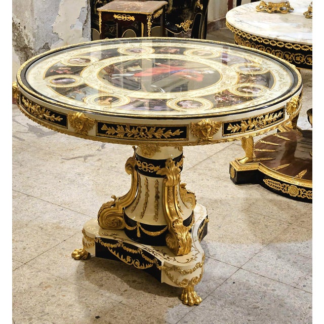 Beautiful French Rococo style round pedestal dining table featuring a refined white finish that evokes sophistication and...