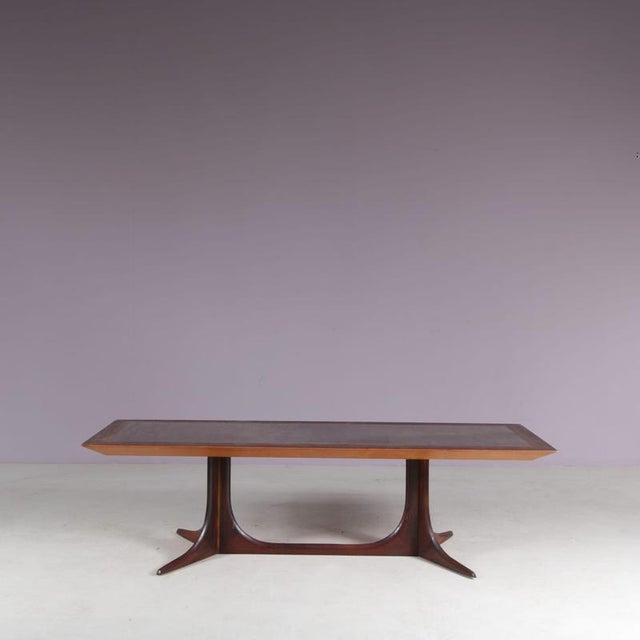 A large, warm wooden coffee table, manufactured in Denmark around 1960. This beautiful table is made of high quality oiled...