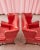 Stunning pair of mid-century leather wingback chairs or wing chairs featuring a dramatic ruby red leather upholstery. Made...