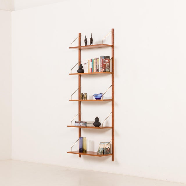 A minimalist, danish teak shelving unit in teak comes from the 1960s. It’s a perfect addition to any interior and an...