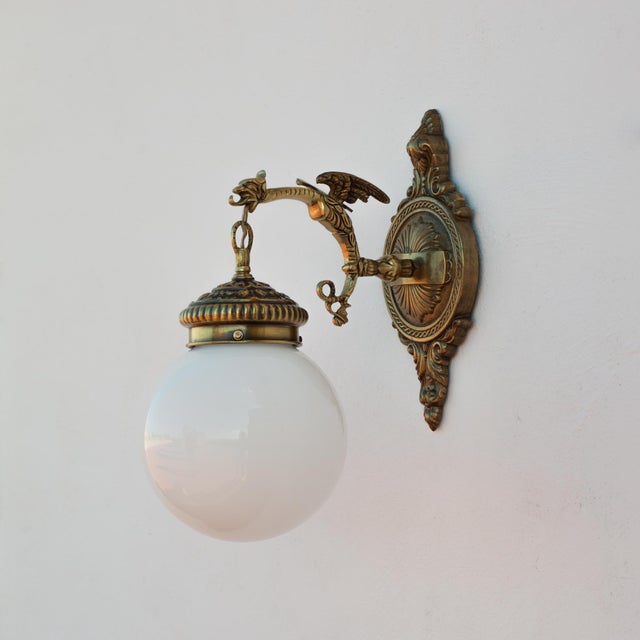 Metal 1960s Spanish Gothic Gold Brass Winged Griffin Wall Sconce With Opaline Glass Globe For Sale - Image 7 of 8