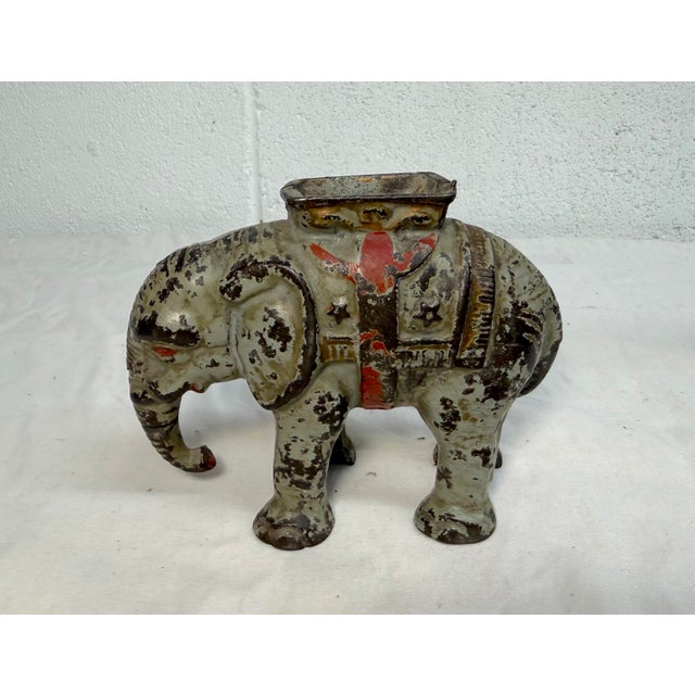 Up for sale is a rare antique early 1900s hand-painted cast iron circus elephant with howdah still bank. This collectible...