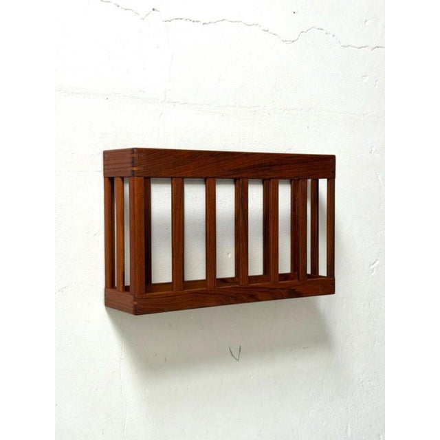 Danish Teak Wall-Mounted Magazine Rack, 1960s A beautifully crafted Danish wall-mounted magazine rack from the 1960s,...