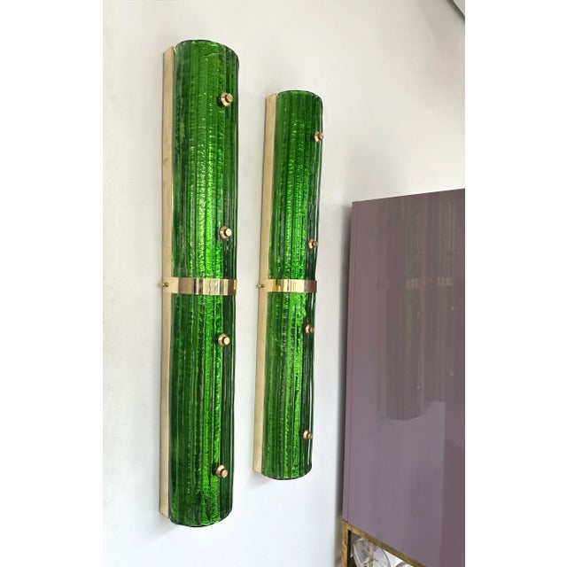 Pair of brass and green Murano glass wall lights lightning pannel lamps sconces. Contemporary work from a small artisanal...