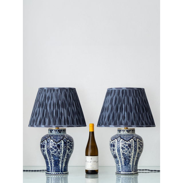 Dutch delft blue and white ceramic table lamps, a pair of baluster vases made by boch for royal sphinx in the netherlands,...