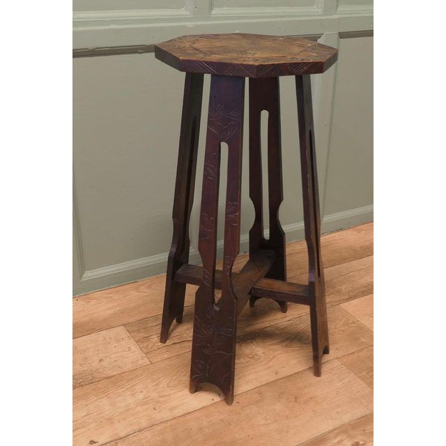 Liberty & Co Arts and Crafts Carved Elm Octagonal Plant Stand This piece is being offered from a dispersal sale of Arts...